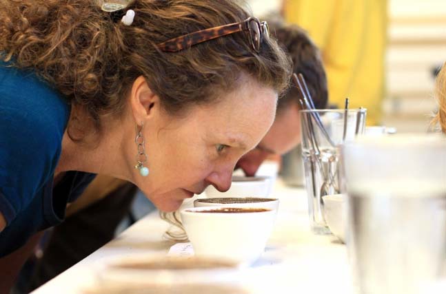 Linda Burnside of Alternative Grounds joins her colleagues at the cupping table. Calibrating exercises are par for the course in order to keep our palates in sync!